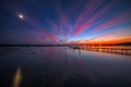 Wooden Dock and fishing boat at the lake, sunset shot Royalty Free Stock Photo