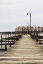 Wooden dock with light posts on a lake Royalty Free Stock Photo