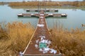 Wooden dock with NoFishing sign on a calm lake