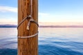 Wooden dock pier post for boat mooring at seaside