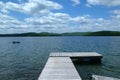 Wooden dock walking towards a lake,