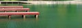 Wooden docks piers on park lake