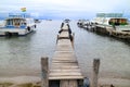 Wooden Docks Surrounded by the Boats to Isla Del Sol on Lake Titicaca at the town of Copacabana, Bolivia Royalty Free Stock Photo