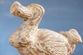 Wooden Dodo bird - typical souvenir from Mauritius island over the blue background. Royalty Free Stock Photo