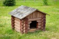 Wooden dog house  on green lawn. Royalty Free Stock Photo