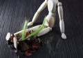 Wooden doll with fresh cereal stalks on the legs, many dried spring fruits lie next to it