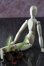 Wooden doll with fresh cereal stalks on the legs, many dried spring fruits lie next to it