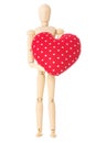 Wooden doll holds heart