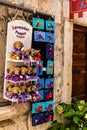 Wooden dolls dressed in purple with a lavender bag and different gifts with sea animals