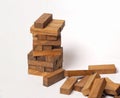 Wooden domino building was destroy in trend decreasing of business Royalty Free Stock Photo