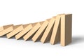 Wooden dominoes falling with last piece standing Royalty Free Stock Photo