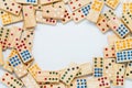 Wooden dominos and space in the middle on white background with selective focus Royalty Free Stock Photo