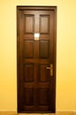 Wooden door with golden handle