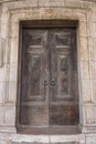 Wooden door of ancient church in Lisbon, Portugal. Historical building details. Old house. Vintage stone cathedral. Royalty Free Stock Photo