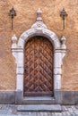 Wooden door in the arched doorway of an old house Royalty Free Stock Photo