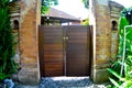 Wooden door belonging to a resident in Ubud, Bali - Indonesia.