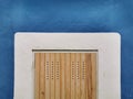 Wooden door and blue-dyed wall of an old building Royalty Free Stock Photo