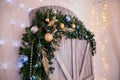 Wooden door with Christmas decorations inside of the room in studio Royalty Free Stock Photo