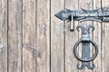 Wooden door, close-up. Metal handle and lock. Royalty Free Stock Photo