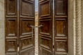 A wooden door closed by a chain with padlock at the entrance to one of the many buildings destroyed by the 2016 earthquake, Norcia Royalty Free Stock Photo