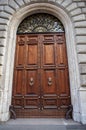 Solid wooden door - Rome, landmark attraction in Italy. Wooden background