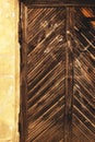 Wooden door with diagonal plank ornament in sepia