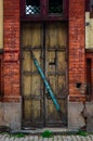 The wooden door of dilapidated building in a city Royalty Free Stock Photo