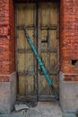 The wooden door of dilapidated building in a city Royalty Free Stock Photo