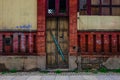 The wooden door of dilapidated building in a city Royalty Free Stock Photo