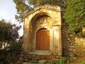 Wooden Door on the Facade of Vintage Stone Building in Plaka Historic Neighborhood of Athens, Greece Royalty Free Stock Photo