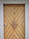 A wooden door with a flower