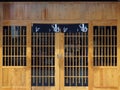 Wooden door and front wall, Japanese or Chinese restaurant, space for the name of the restaurant or text and logo