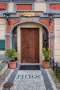 Wooden door of a historic burgher house in the center of Prague