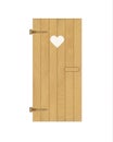 Wooden door of the latrine with heart