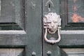 Wooden door with lock and knocker