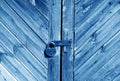Wooden door with lock in navy blue tone Royalty Free Stock Photo