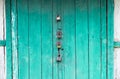 Wooden door locked by 4 different padlocks Royalty Free Stock Photo