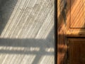 Sun light on a cement wall with the wooden door Royalty Free Stock Photo