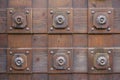 Wooden door with metal ornaments closeup Royalty Free Stock Photo