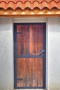 Wooden door with metal ornaments Royalty Free Stock Photo