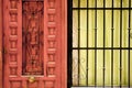 Wooden door next to window with green curtain Royalty Free Stock Photo