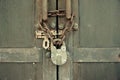 Wooden door with old chain and padlock Royalty Free Stock Photo