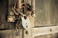 Wooden door with old chain and padlock Royalty Free Stock Photo