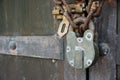 Wooden door with old chain and padlock Royalty Free Stock Photo