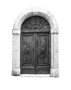 Wooden door in an old Italian house, isolated on white background, clipping path. Royalty Free Stock Photo