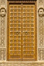 Wooden door and ornament on wall of palace in Jaisalmer fort, India.