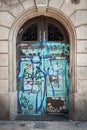 Wooden door painted with graffiti in Barcelona town