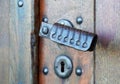 Wooden door with a rustic door handle.