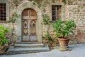 Wooden door in a small village of medieval origin. Volpaia, Tuscany, Italy