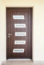 Wooden door with small wondows Royalty Free Stock Photo